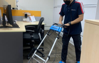 A Man Cleaning a Carpet