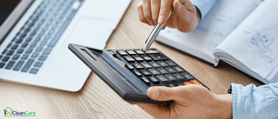 Male accountant using a calculator