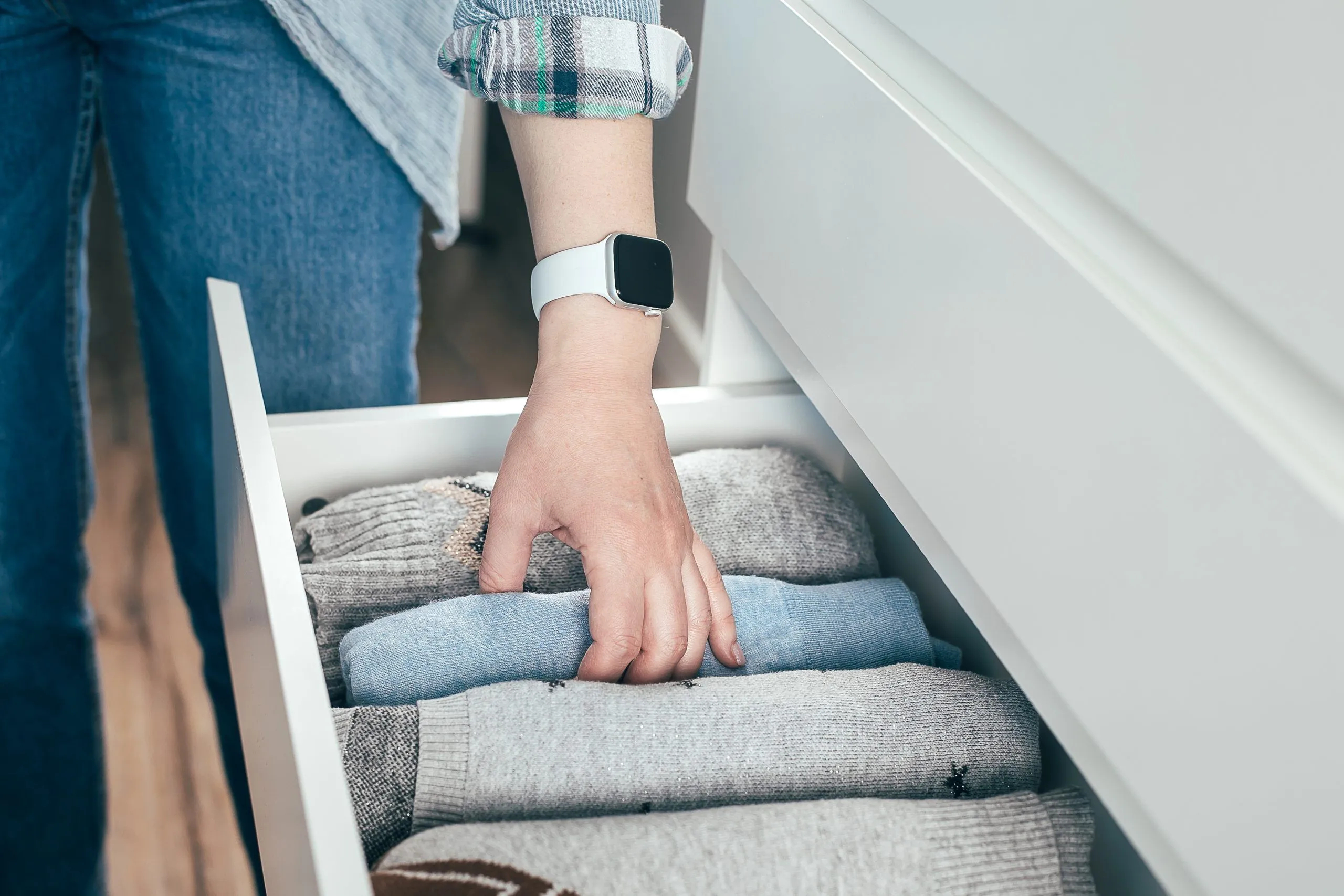 woman folding clothes
