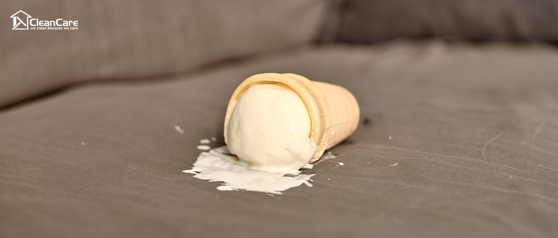Ice cream stain spilled on a fabric sofa.