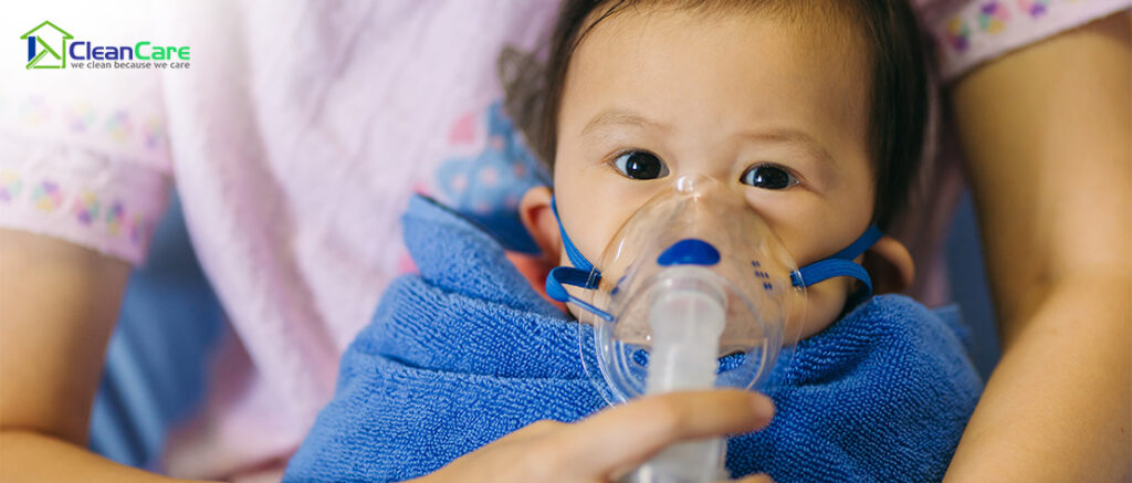 Baby wearing an oxygen mask due to respiratory issues.