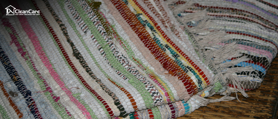 Display of vibrant, patterned handwoven rugs.