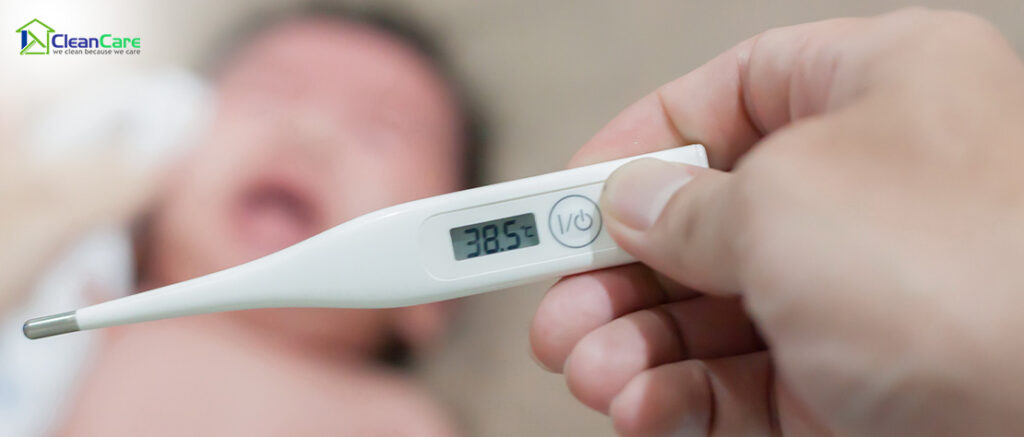 Thermometer reading a high temperature on a baby.